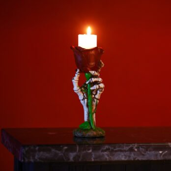 Hand-Painted Skeleton Hand with Rose Candle Holder Hand-Painted Skeleton Hand with Rose Candle Holder